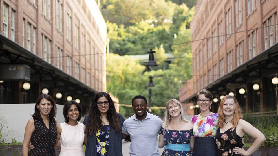 Members of the Emerging Professionals network stand together in a row